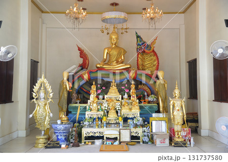Luang Pho Mongkhonchok is enshrined in the ordination hall of Wat Nong Jab Tao, a temple with a beautiful white chapel. It stands out with the beautiful stucco art of Naga sculptures. 131737580