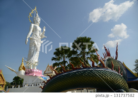 Phra Phutthaphon Sri Asvamuni, a 28-meter-high standing Buddha statue bestowing blessings at Wat Nong Jab Tao is a temple with a beautiful white ordination hall.  131737582