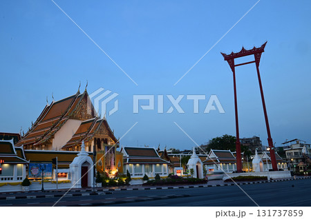 Awesome view of Wat Suthat Thepwararam in Bangkok, Thailand. Amazing exterior of the temple. The Buddhist temple is a landmark in Bangkok and a popular tourist attraction of Thailand. 131737859
