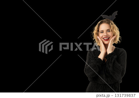 Woman shows Halloween spirit with fun outfit accessories Woman shows Halloween spirit with fun outfit accessories 131739837