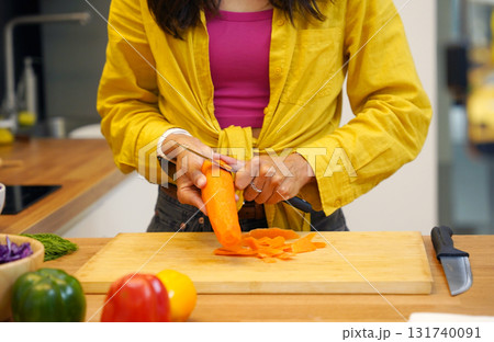Young woman is broadcasting live from workshop how to prepare a vegetarian food Young woman is broadcasting live from workshop how to prepare a vegetarian food 131740091