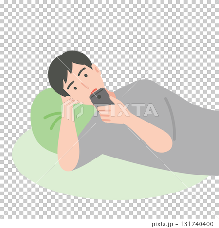 A man using a smartphone while lying down A man using a smartphone while lying down 131740400