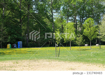 Urban Green Space with Recycling Bins and Benches in Spring Park 131740483