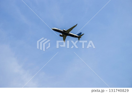 Airplane Flying Through Clear Blue Sky 131740829