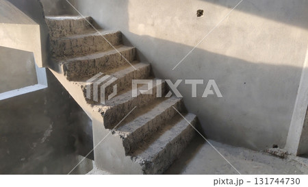 View of unfinished concrete staircase in a building under construction area 131744730