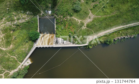 tilt shot of fishing net near water dam spillway in pakistan village showing rural life agriculture and natural scenery 131744764