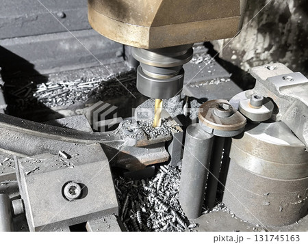 A machine tool in metal factory with drilling cnc machines for engineering A machine tool in metal factory with drilling cnc machines for engineering 131745163