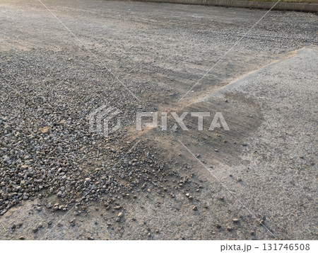 Half completed road showing contrast of finished and unfinished surface 131746508