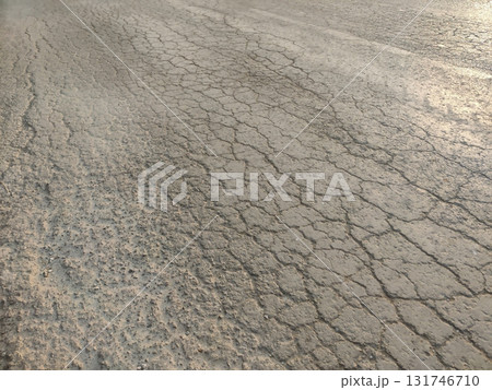 Cracks on asphalt road surface showing damage and broken infrastructure Cracks on asphalt road surface showing damage and broken infrastructure 131746710