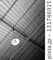 Industrial Metal Ceiling with Hanging White Light Fixture 131746915