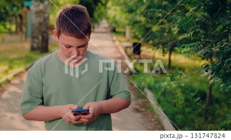 influenced by social media recommendations today, boy taps smartphone, curious boy navigates smartphone settings for safer social media use, guided by social media influencer reviews, receives social influenced by social media recommendations today, boy taps smartphone, curious boy navigates smartphone settings for safer social media use, guided by social media influencer reviews, receives social 131747824