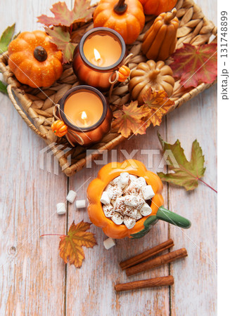 Cozy autumn arrangement with hot chocolate and candles Cozy autumn arrangement with hot chocolate and candles 131748899