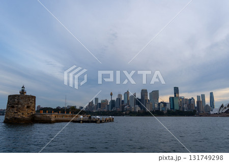 Sydney skyline at sunset with golden reflections on the water 131749298