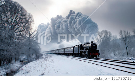 A steam train rushes through the snow, smoke comes out of the chimney. Pressnitztalbahn steam train locomotive railway in winter 131750719