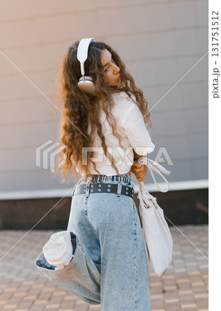 Teen Girl Having Fun With Headphones 131751512