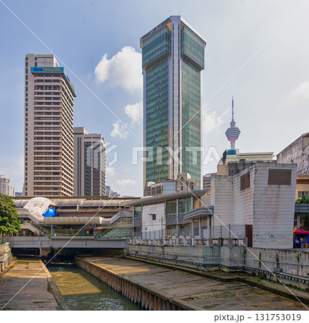 View of Kuala Lumpur skyline from Klang River, featuring KL Tower, Bank Muamalat, Wisma Lee Rubber, and LRT station, Malaysia 131753019