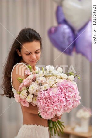 female hands holding bouquet flowers. Gift on the 8 march or valentines day. pink hydrangea 131753828