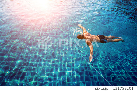 Young athletic man swimming in the swimming pool Young athletic man swimming in the swimming pool 131755101