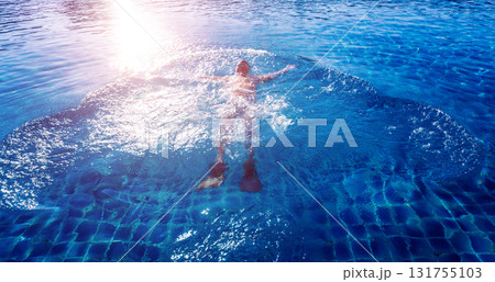 Young athletic man swimming in the swimming pool Young athletic man swimming in the swimming pool 131755103