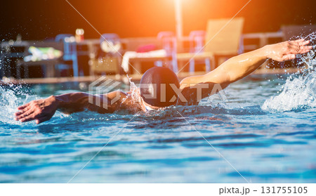 Young athletic man swimming in the swimming pool Young athletic man swimming in the swimming pool 131755105