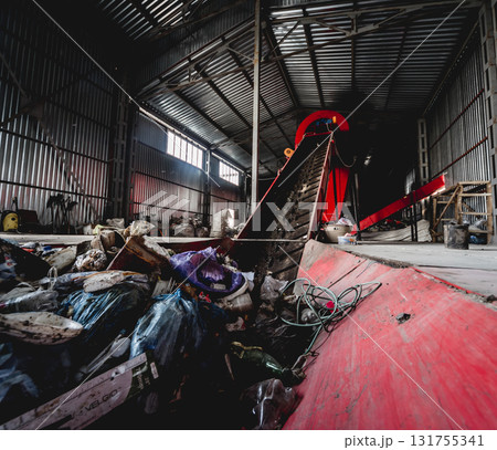 At modern recycling plant. Conveyor belt for transports garbage At modern recycling plant. Conveyor belt for transports garbage 131755341