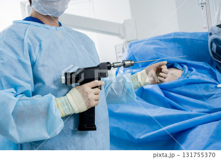 Arthroscope surgery. Orthopedic surgeons in teamwork in the operating room  131755370