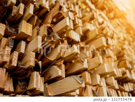 Stack of natural rough wooden boards. Wooden boards, lumber, industrial wood. 131755479