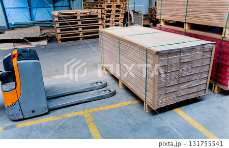 Forklift loader in storage warehouse ship yard. Distribution products.  131755541