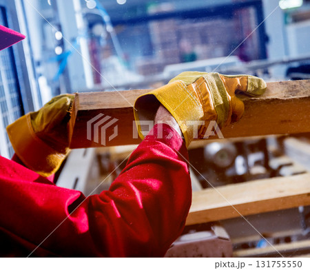 Carpenter with fibreboards at furniture factory workshop. Woodworking industry 131755550