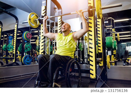 Disabled man training in the gym of rehabilitation center Disabled man training in the gym of rehabilitation center 131756136