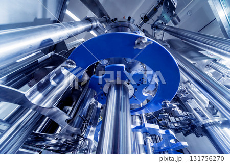 Automatic filling machine pours water into plastic PET bottles. Automatic filling machine pours water into plastic PET bottles. 131756270