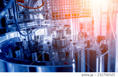 Automatic filling machine pours water into plastic PET bottles. Automatic filling machine pours water into plastic PET bottles. 131756325