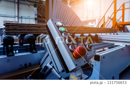 Production line of the wooden floor factory. CNC automatic woodworking machine. 131756653