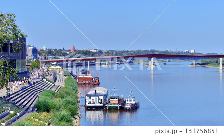 Warsaw, Poland. 15 August 2025. View of the pedestrian and bicycle bridge over the Vistula. Warsaw, Poland. 15 August 2025. View of the pedestrian and bicycle bridge over the Vistula. 131756851