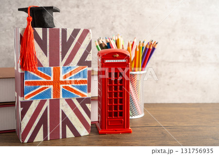 UK flag with graduate hat on english language book. 131756935