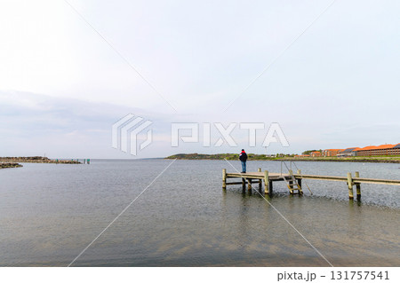 Long wooden pier on the sea. Landscape view. 131757541
