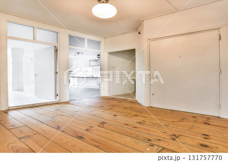 Light-filled room featuring wooden flooring and modern design elements, perfect for contemporary living or as a workspace. Light-filled room featuring wooden flooring and modern design elements, perfect for contemporary living or as a workspace. 131757770