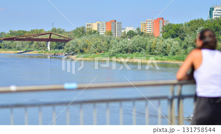 Depressed woman standing on a bridge. Negative attitude. Suicide prevention concept Depressed woman standing on a bridge. Negative attitude. Suicide prevention concept 131758544