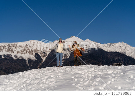 Mountains Snow Women Winter Recreation: Alpine Fun, Sunny Day, Snowy Peak Mountains Snow Women Winter Recreation: Alpine Fun, Sunny Day, Snowy Peak 131759063