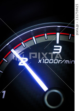 Close-up of a diesel truck's dashboard and tachometer. It represents the power and durability of a work vehicle, with a clear focus on the round engine meters. Close-up of a diesel truck's dashboard and tachometer. It represents the power and durability of a work vehicle, with a clear focus on the round engine meters. 131759425