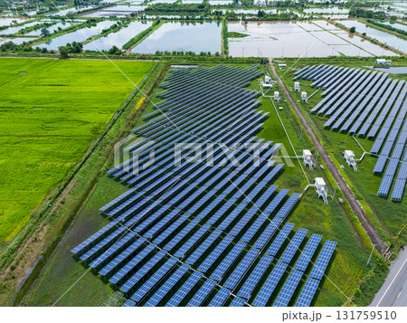 Aerial view drone shot scenic landscape of a road passing through a solar farm in Thailand Aerial view drone shot scenic landscape of a road passing through a solar farm in Thailand 131759510