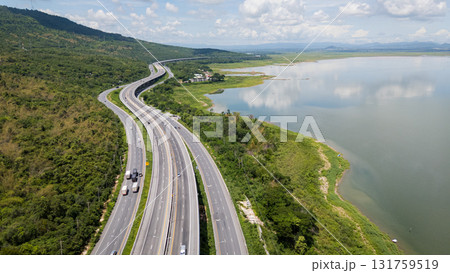 Drone shot The M6 motorway Nakhon Ratchasima Province - Bang Pa-in Lam Ta Khong River and Mountain. Motorway Korat Thailand Drone shot The M6 motorway Nakhon Ratchasima Province - Bang Pa-in Lam Ta Khong River and Mountain. Motorway Korat Thailand 131759519
