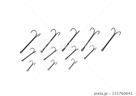 double hooks for fishing of various sizes on a white background close-up double hooks for fishing of various sizes on a white background close-up 131760641