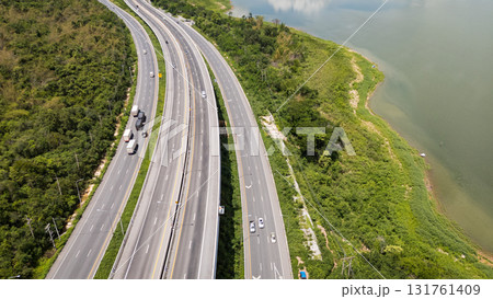 Drone shot The M6 motorway Nakhon Ratchasima Province - Bang Pa-in Lam Ta Khong River and Mountain. Motorway Korat Thailand Drone shot The M6 motorway Nakhon Ratchasima Province - Bang Pa-in Lam Ta Khong River and Mountain. Motorway Korat Thailand 131761409