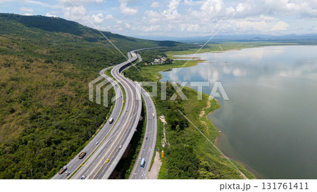 Drone shot The M6 motorway Nakhon Ratchasima Province - Bang Pa-in Lam Ta Khong River and Mountain. Motorway Korat Thailand Drone shot The M6 motorway Nakhon Ratchasima Province - Bang Pa-in Lam Ta Khong River and Mountain. Motorway Korat Thailand 131761411