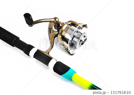 fishing reel on a fishing rod, white background close-up fishing reel on a fishing rod, white background close-up 131761610