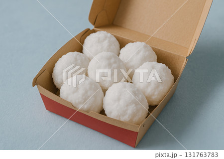 Creative fast food concept with snowballs, unconventional ingredients presented as meal in takeout box on blue background, AI Generative 131763783