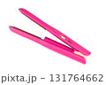 Cordless pink hair straightener, isolated on a white background. 131764662
