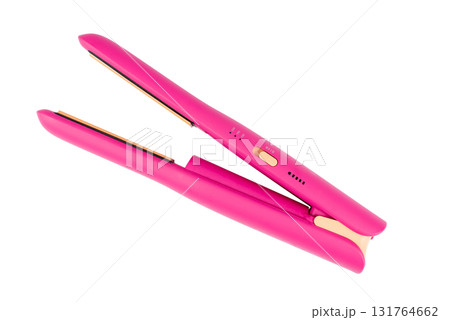 Cordless pink hair straightener, isolated on a white background. 131764662