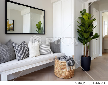 Modern interior space with a mirror, a bench, and a stylish plant 131766341